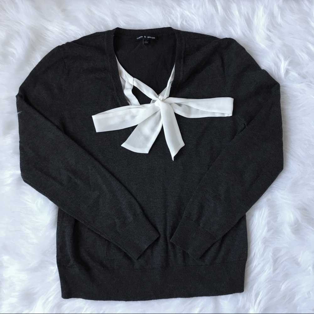 Dark grey sweater with elegant white details